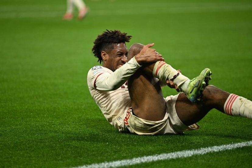 Bayern Munich's French forward #11 Kingsley Coman reacts injured during the UEFA Champions League last 16, second leg, football match between Bayer Leverkusen and Bayern Munich in Leverkusen, western Germany on March 11, 2025.   INA FASSBENDER / AFP