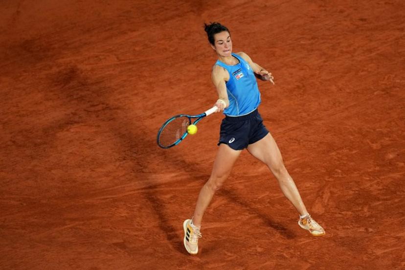 US Coco Gauff plays a forehand return to France's Lois Boisson during their women's singles semi-final match on day 12 of the French Open tennis tournament on Court Philippe-Chatrier at the Roland-Garros Complex in Paris on June 5, 2025.  Dimitar DILKOFF / AFP