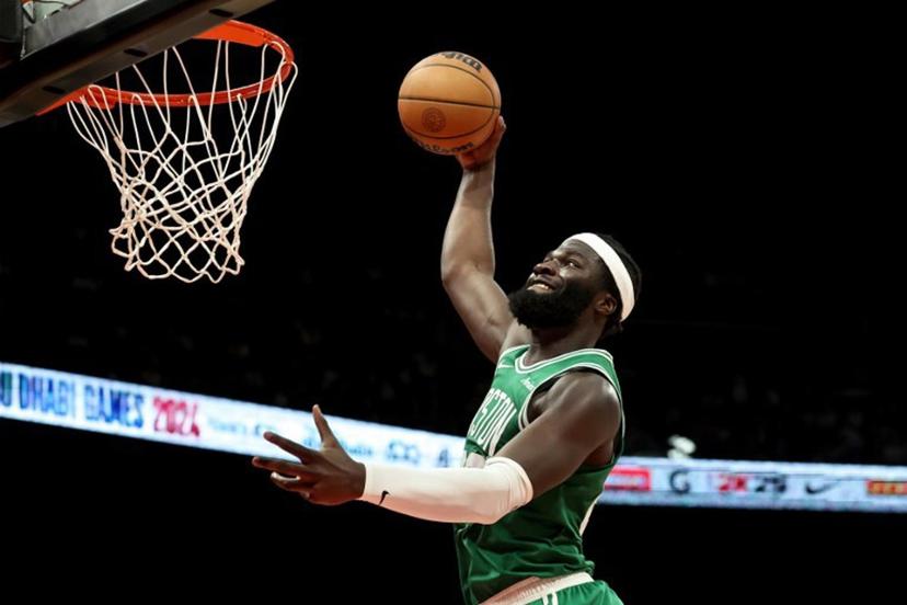 Boston Celtics' forward #28 Anton Watson dunks during the NBA Preseason game between the Boston Celtics and the Denver Nuggets at the Etihad Arena in Abu Dhabi on October 6, 2024.  Fadel Senna / AFP