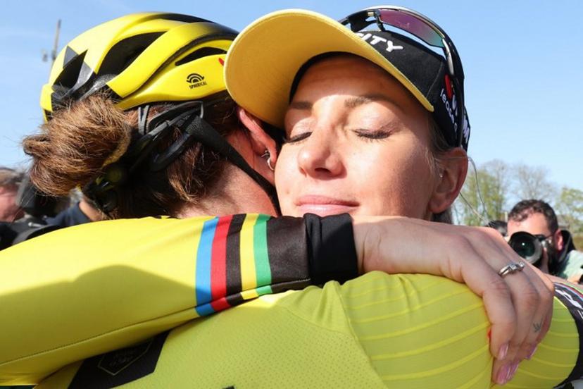 Team Visma-Lease a Bike's French rider Pauline Ferrand Prevot (R) celebrates with Team Visma-Lease a Bike's Dutch rider Marianne Vos (L) after winning the fifth edition of the Paris-Roubaix women's race, 148,5 km between Denain and Roubaix, northern France on April 12, 2025.  Francois LO PRESTI / AFP