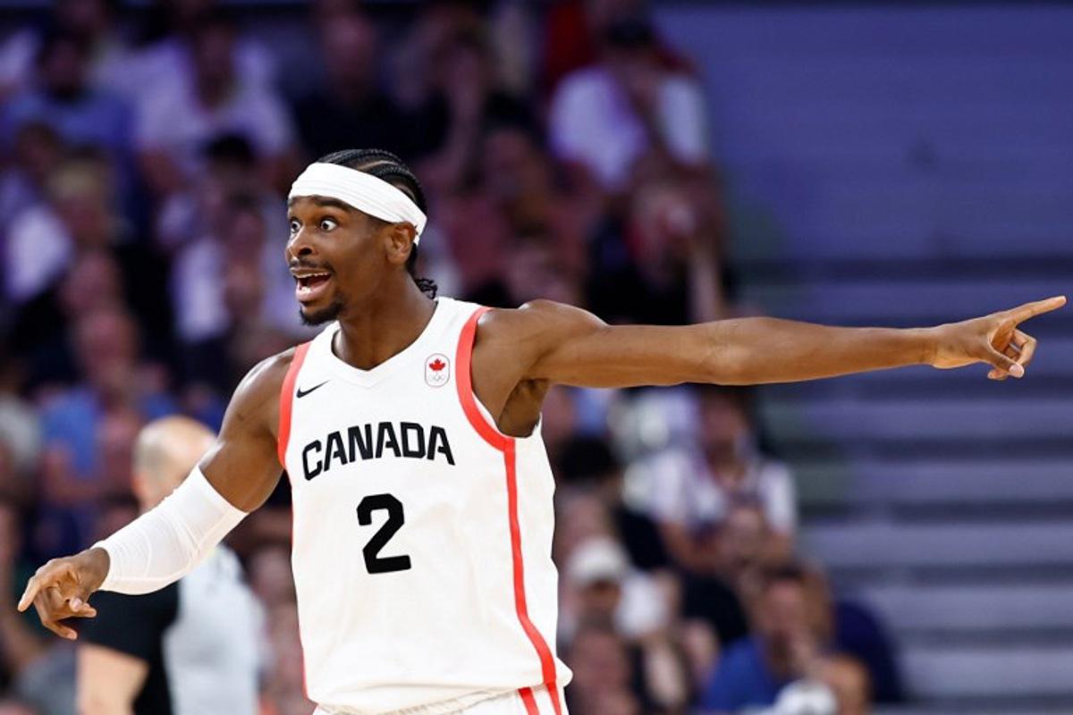 Canada's #02 Shai Gilgeous-Alexander reacts in the men's preliminary round group A basketball match between Canada and Australia during the Paris 2024 Olympic Games at the Pierre-Mauroy stadium in Villeneuve-d'Ascq, northern France, on July 30, 2024.  Sameer Al-Doumy / AFP