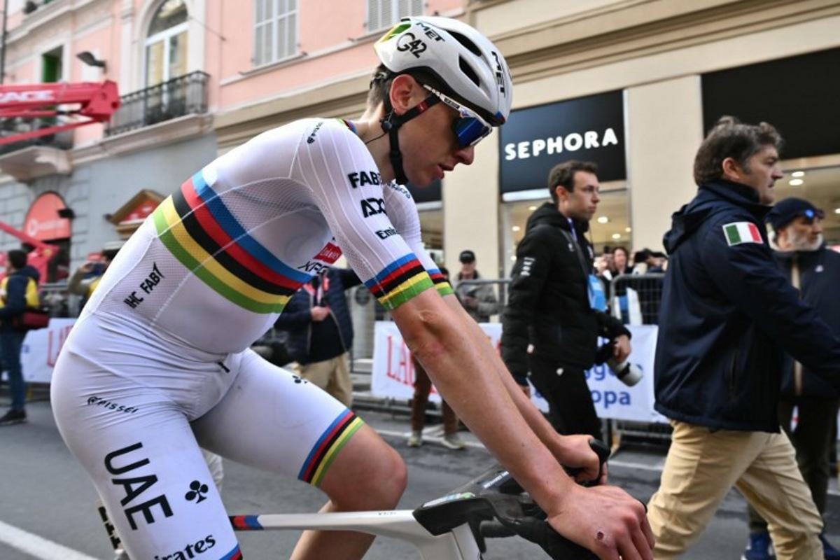 Team UAE's Slovenian rider Tadej Pogacar, third, is pictured after the Milan - Sanremo one-day classic cycling race, on March 22, 2025. Dutch Mathieu Van Der Poel of team Alpecin-Deceuninck won the race ahead of Team Ineos' Italian rider Filippo Ganna and Team UAE's Slovenian rider Tadej Pogacar, third.  Marco BERTORELLO / AFP
