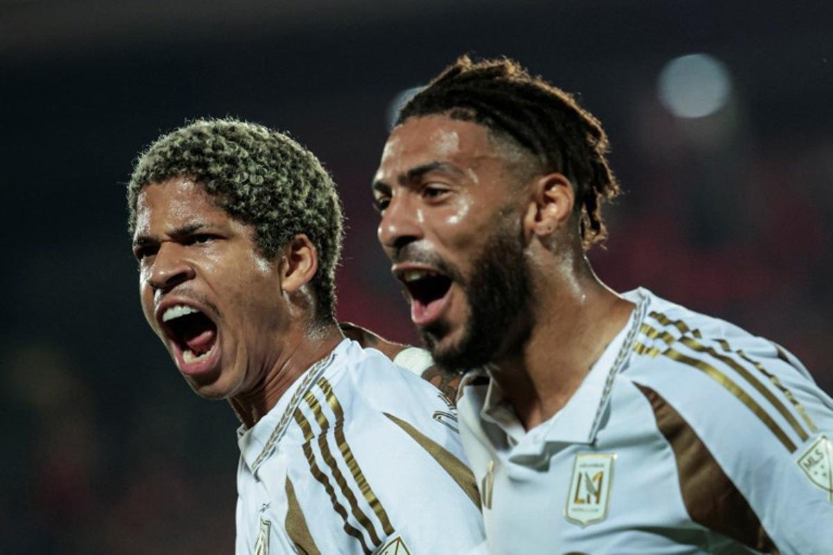 Los Angeles FC's Venezuelan forward #30 David Martinez (L) celebrates with teammate Gabonese forward #99 Denis Bouanga after scoring his team's second goal during the CONCACAF Central American Cup round of 16 second leg football match between Costa Rica's Alajuelense and US' Los Angeles FC at the Alejandro Morera Soto Stadium in Alajuela, Costa Rica on March 17, 2026.  JOHN DURAN / AFP