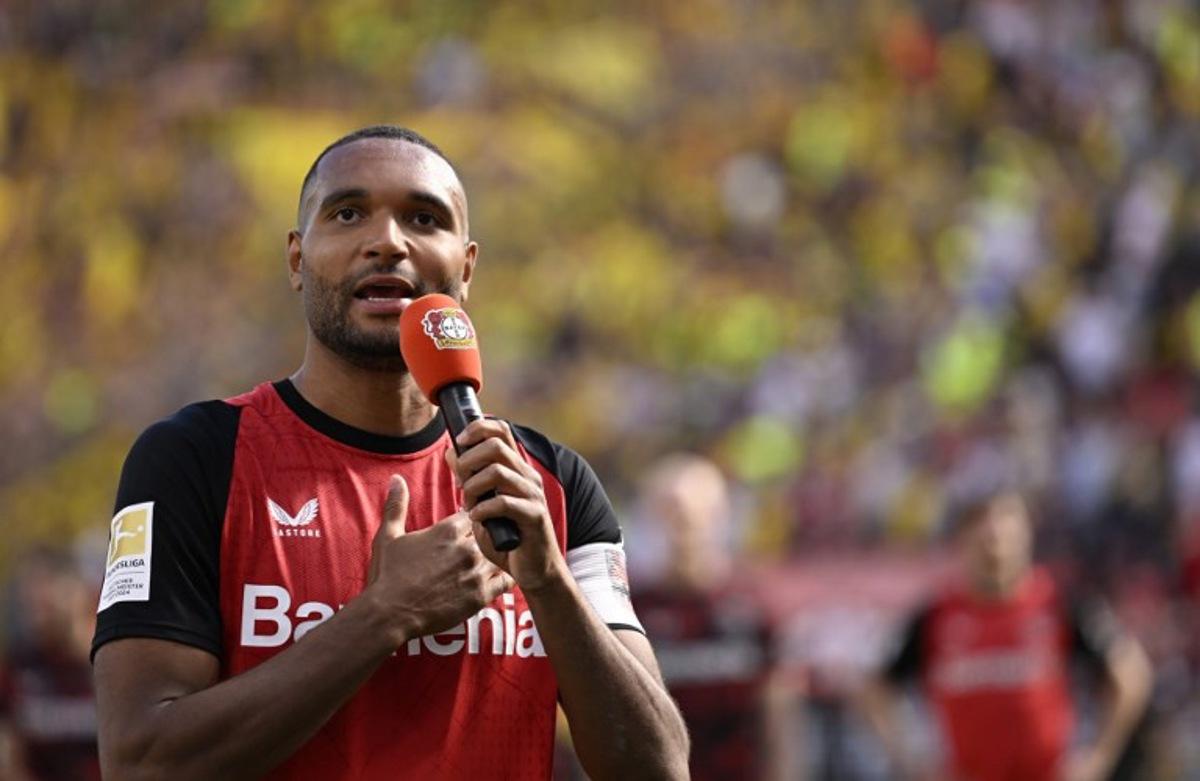 Bayer Leverkusen's German outgoing defender #04 Jonathan Tah thanks supporters after the German first division Bundesliga football match between Bayer 04 Leverkusen and Borussia Dortmund in Leverkusen, western Germany, on May 11, 2025.  INA FASSBENDER / AFP
