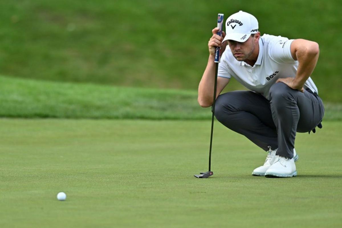 Belgium's Thomas Detry lines up a putt on the 18th green on day two of the BMW PGA Championship at Wentworth Golf Club, south-west of London, on September 15, 2023.  Glyn KIRK / AFP
