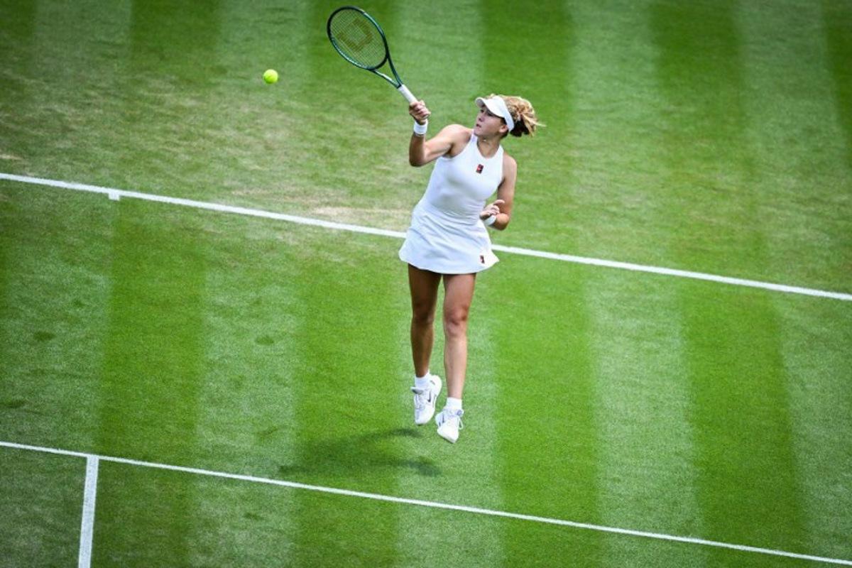 Russia's Mirra Andreeva plays a forehand return to Italy's Lucia Bronzetti during their women's singles second round tennis match on the fourth day of the 2025 Wimbledon Championships at The All England Lawn Tennis and Croquet Club in Wimbledon, southwest London, on July 3, 2025.  Kirill KUDRYAVTSEV / AFP