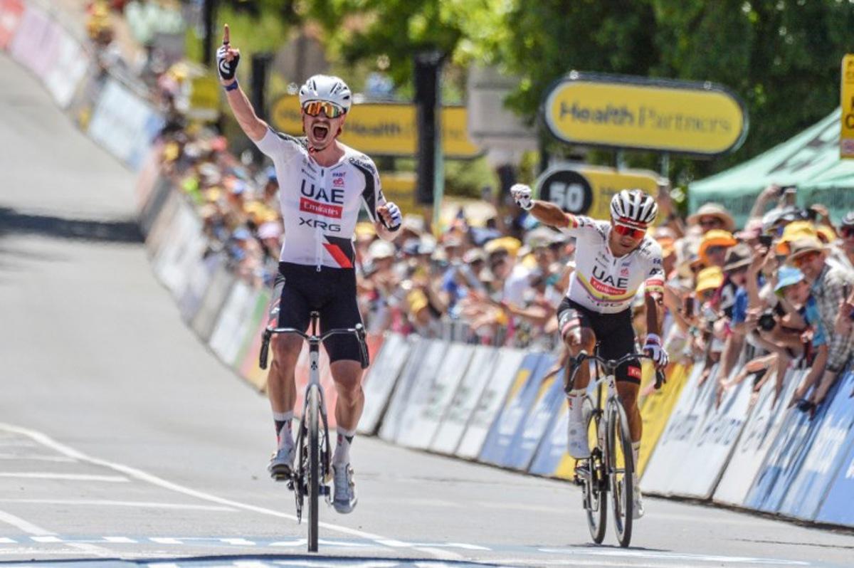 UAE Team Emirates XRG rider Jhonatan Narvaez from Ecuador (R) reacts as his teammate Australia's Jay Vine wins stage two of the Tour Down Under UCI men's cycling race in Adelaide on January 22, 2026.  Brenton Edwards / AFP
