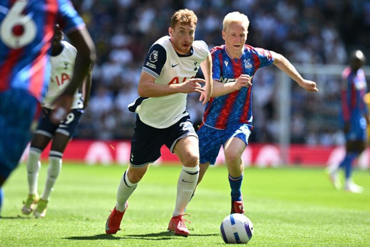 Tottenham Hotspur's Swedish midfielder #21 Dejan Kulusevski (L) runs away from Crystal Palace's English midfielder #19 Will Hughes (R) during the English Premier League football match between Tottenham Hotspur and Crystal Palace at the Tottenham Hotspur Stadium in London, on May 11, 2025.  Ben STANSALL / AFP
