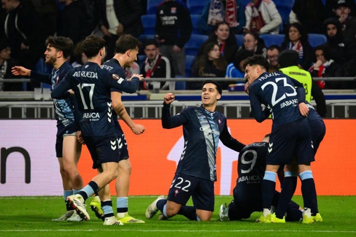 Celta Vigo's players celebrate after Ferran Jutgla scored their second goal during the UEFA Europa League last 16 second leg football match between Olympique Lyonnais (OL) and Celta Vigo at the Groupama Stadium in Lyon, central-eastern France, on March 19, 2026.  OLIVIER CHASSIGNOLE / AFP
