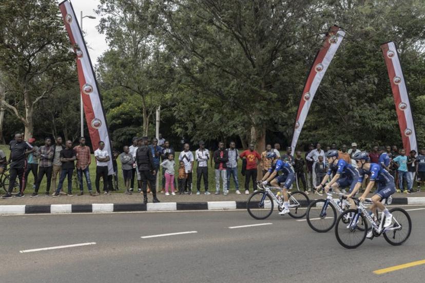 Residents gather to look at team Equipe continentale Groupama-FDJ team before the beginning of the final stage of the 16h Tour du Rwanda on 25 February 2024, in Kigali. Israel Premier Tech's British rider Joseph Blackmore, won the Tour of Rwanda which ended on Sunday in the capital Kigali.  Guillem Sartorio / AFP