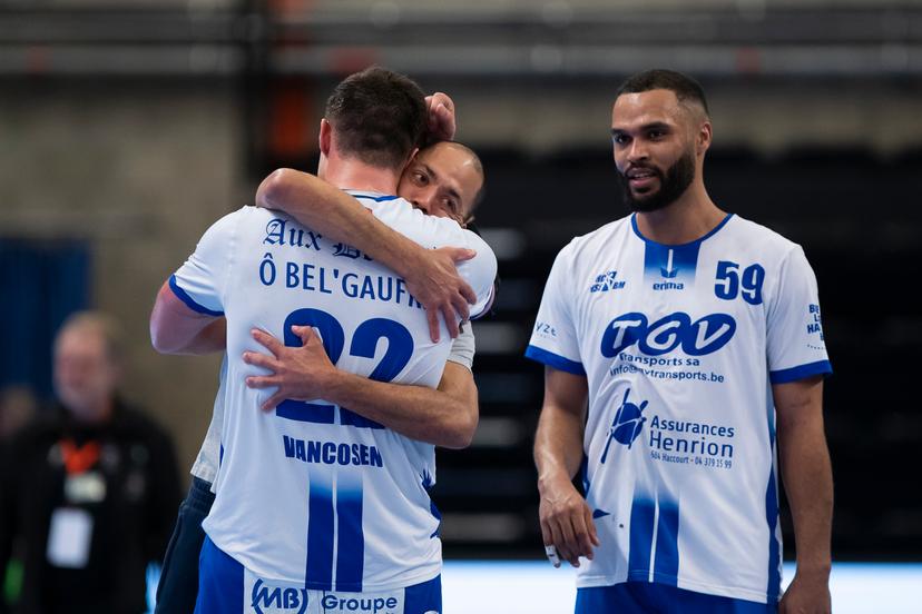 Vise's Yves Vancosen and Vise's physiotherapist Michael Meex celebrate after winning a game between KTSV Eupen and HC Vise BM, Saturday 30 March 2024, in Hasselt, the men's final of the Belgian handball cup. BELGA PHOTO KRISTOF VAN ACCOM