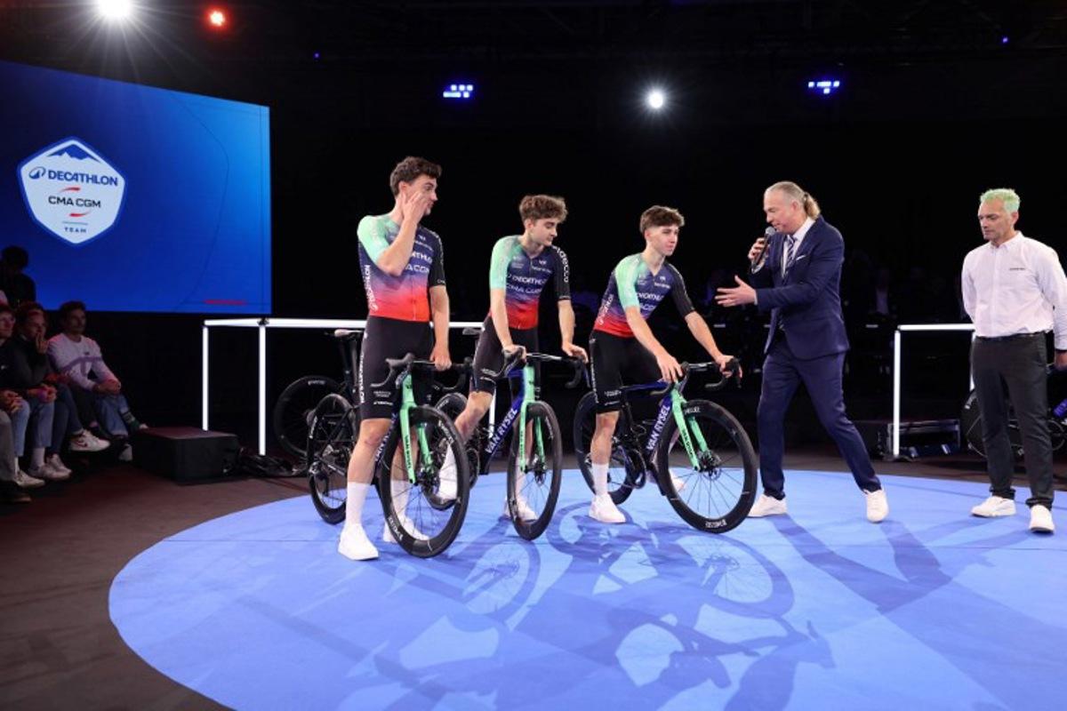 (From L) Decathlon-CMA CGM's Dutch cyclist Olav Kooij, French rider Paul Seixas and French rider Antoine L'Hote attend the presentation of the new Decathlon CMA-GGM cycling team at the Decathlon Campus in Villeneuve-d'Ascq, northern France on December 11, 2025. Francois LO PRESTI / AFP