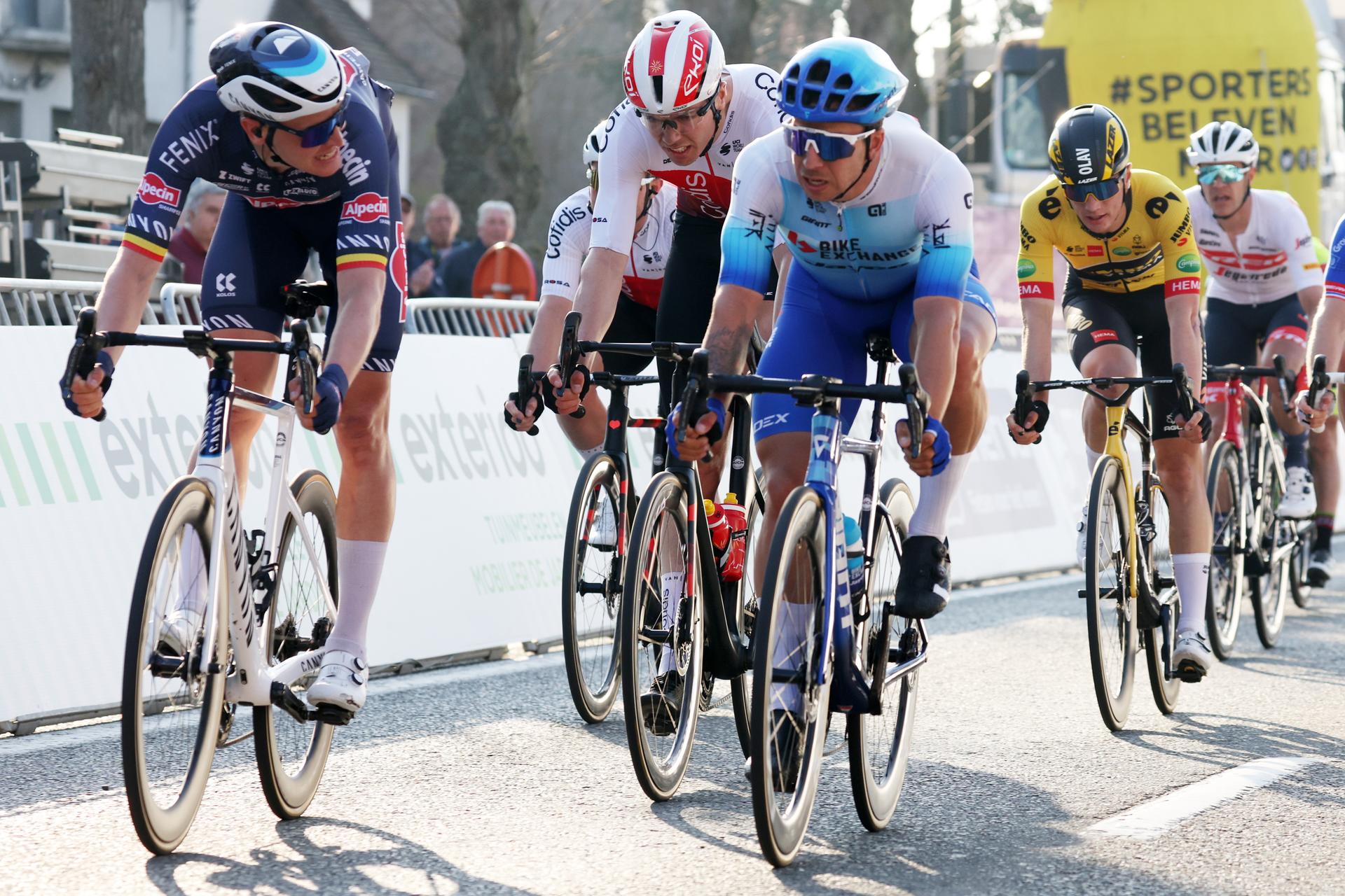 Belgian Tim Merlier of Alpecin-Fenix (L) wins before Dutch Dylan Groenewegen of BikeExchange-Jayco at the finish of the men's elite race of the 'Classic Brugge-De Panne' one-day cycling race, 207,9km from Brugge to De Panne, Wednesday 23 March 2022. BELGA PHOTO KURT DESPLENTER