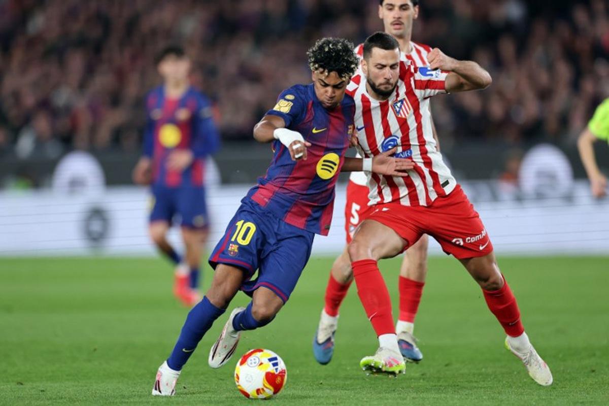 Barcelona's Spanish forward #10 Lamine Yamal and Atletico Madrid's Slovak defender #17 David Hancko fight for the ball during the Copa del Rey (King's Cup) semi final second leg football match between FC Barcelona and Club Atletico de Madrid at Camp Nou Stadium in Barcelona on March 3, 2026.   Josep LAGO / AFP
