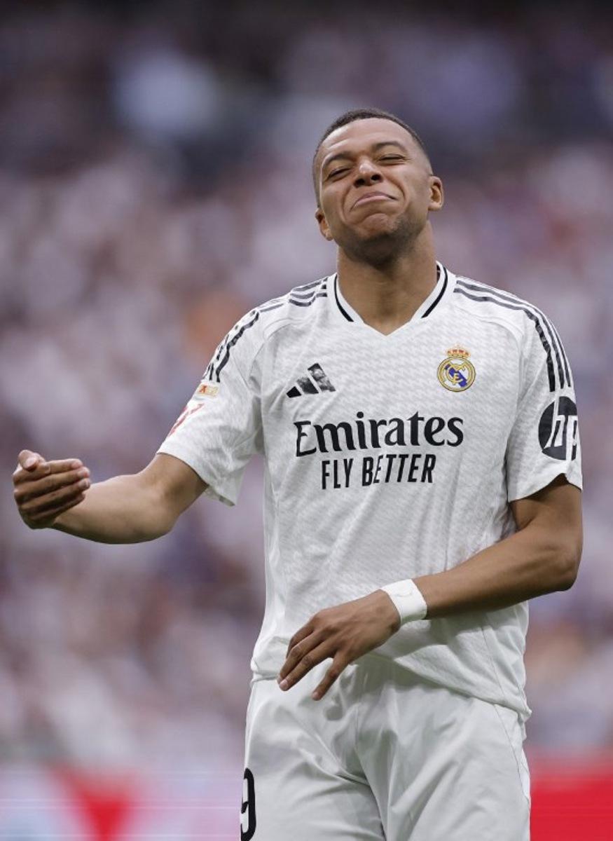 Real Madrid's French forward #09 Kylian Mbappe reacts during the Spanish league football match between Real Madrid CF and Real Sociedad at Santiago Bernabeu Stadium in Madrid on May 24, 2025.  OSCAR DEL POZO / AFP