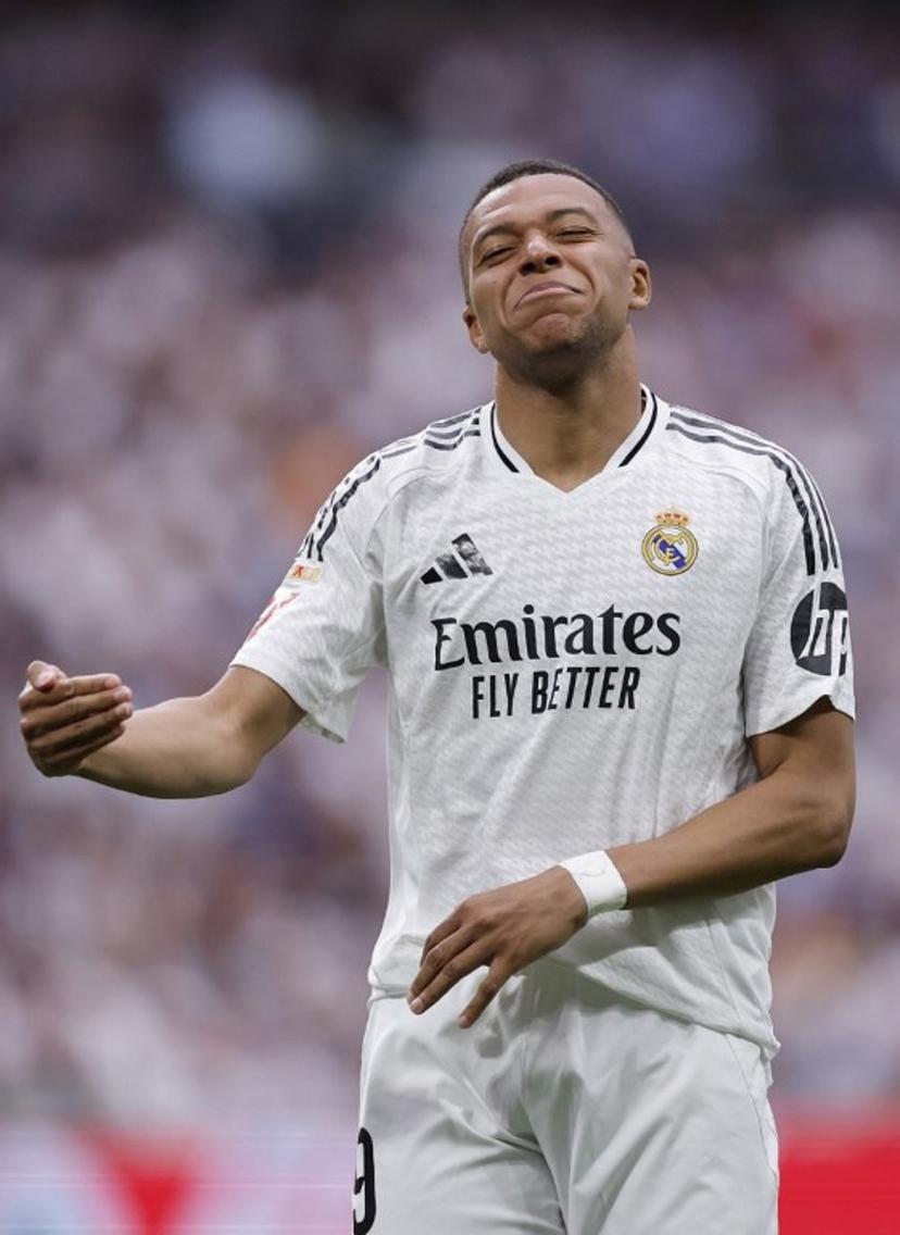 Real Madrid's French forward #09 Kylian Mbappe reacts during the Spanish league football match between Real Madrid CF and Real Sociedad at Santiago Bernabeu Stadium in Madrid on May 24, 2025.  OSCAR DEL POZO / AFP