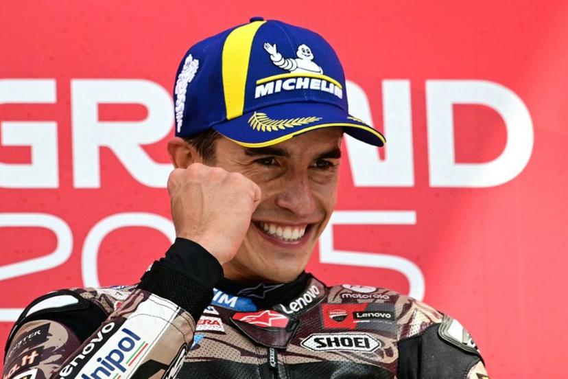 Ducati Lenovoi Team's Spanish MotoGP rider Marc Marquez celebrates first place on the podium after the Italian Moto GP Grand Prix at Mugello circuit, in Mugello, near Florence, on June 22, 2025.   Tiziana FABI / AFP