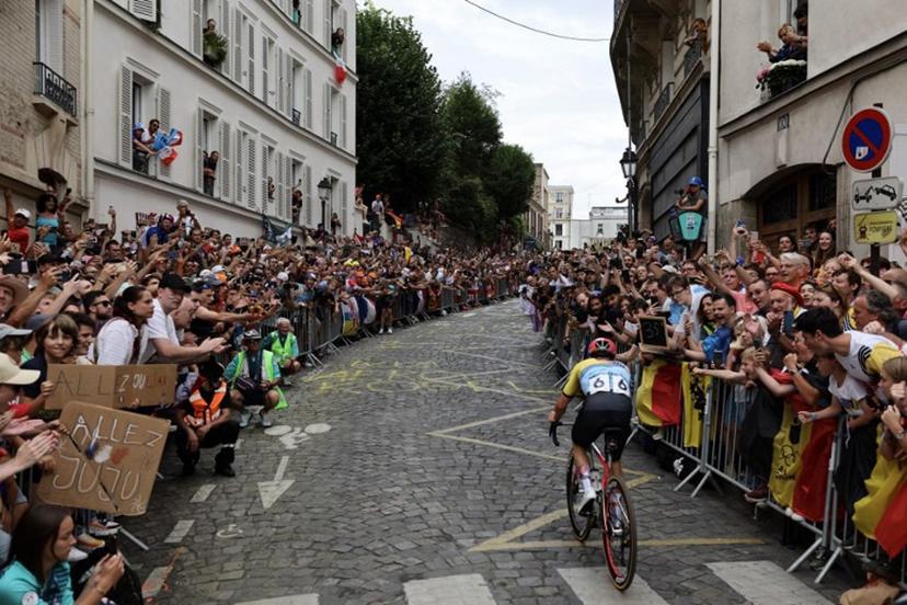 Belgium's Remco Evenepoel cycles in a lone breakaway in Montmartre during the men's cycling road race during the Paris 2024 Olympic Games in Paris, on August 3, 2024.  Tim De Waele / POOL / AFP