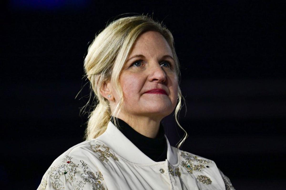 President of the International Olympic Committee (IOC) Kirsty Coventry attends the podium cveremony for the men's cross country 50km mass start final event of the Milano Cortina 2026 Winter Olympic Games, within the games' closing ceremony at the Verona Arena in Verona on February 22, 2026.  Stefano RELLANDINI / AFP