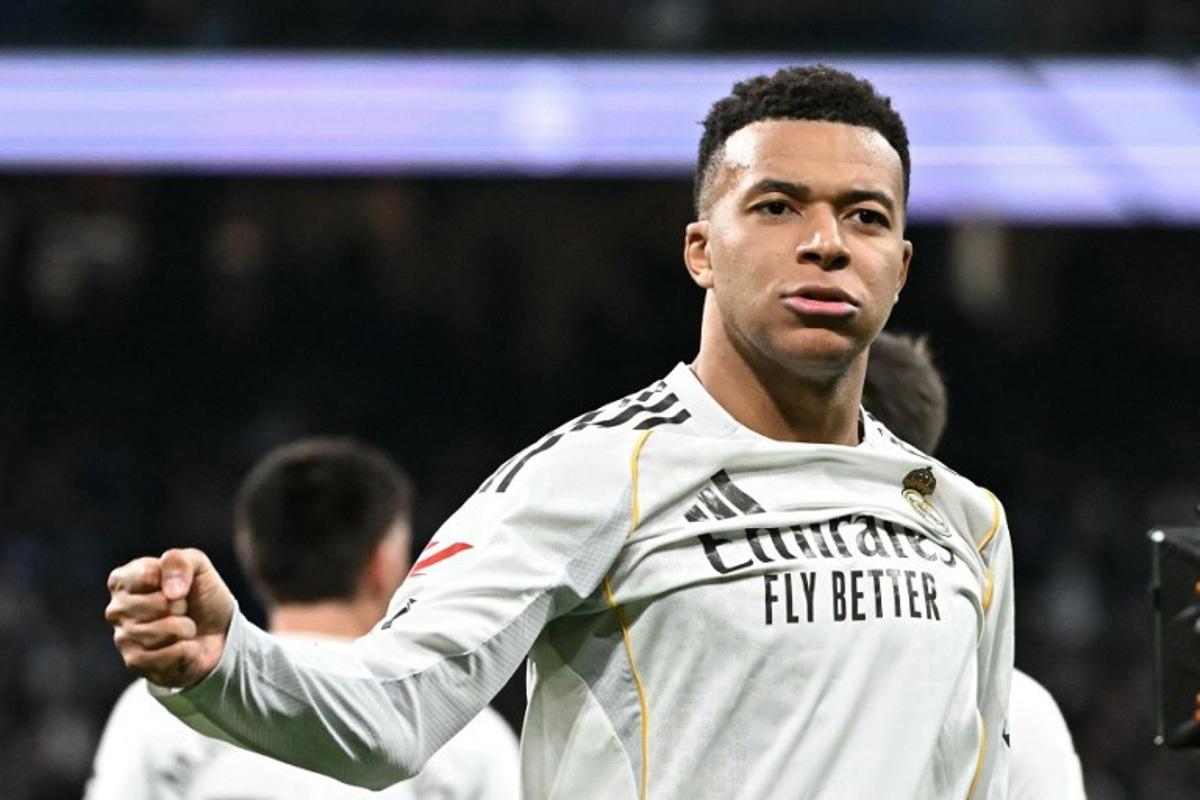 Real Madrid's French forward #10 Kylian Mbappe celebrates scoring the opening goal during the Spanish league football match between Real Madrid CF and Levante UD at Santiago Bernabeu Stadium in Madrid on January 17, 2026.  Javier SORIANO / AFP