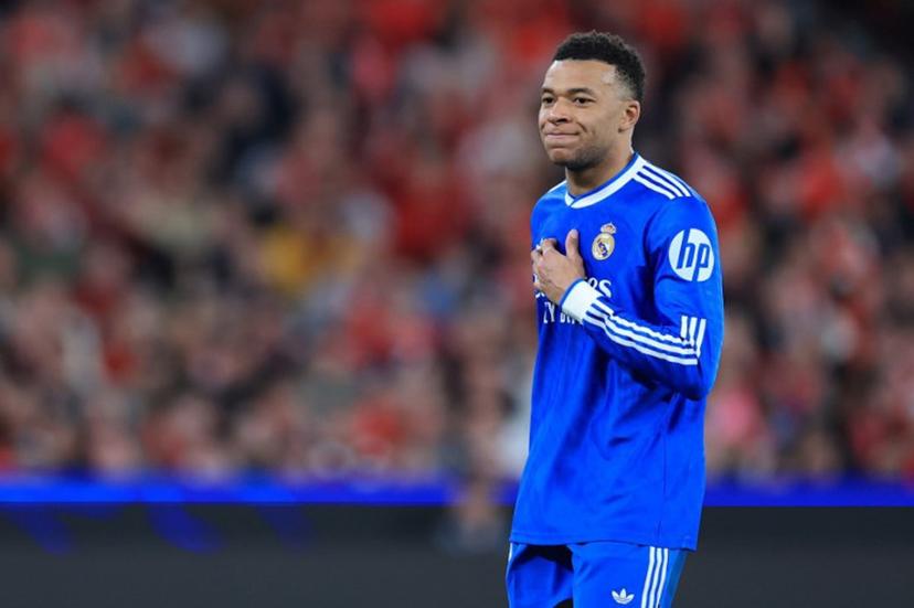 (FILES) Real Madrid's French forward #10 Kylian Mbappe reacts after missing a goal opportunity during the UEFA Champions League knockout round play-off first leg football match between SL Benfica and Real Madrid CF at Estadio da Luz in Lisbon on February 17, 2026. Kylian Mbappe, who has been suffering from a left knee injury since December 2025, is currently in Paris with Real Madrid's medical staff to "assess the progress" of his injury, but no "surgery" is planned "at this stage", AFP learned on March 2, 2026, from the French striker's entourage. PATRICIA DE MELO MOREIRA / AFP