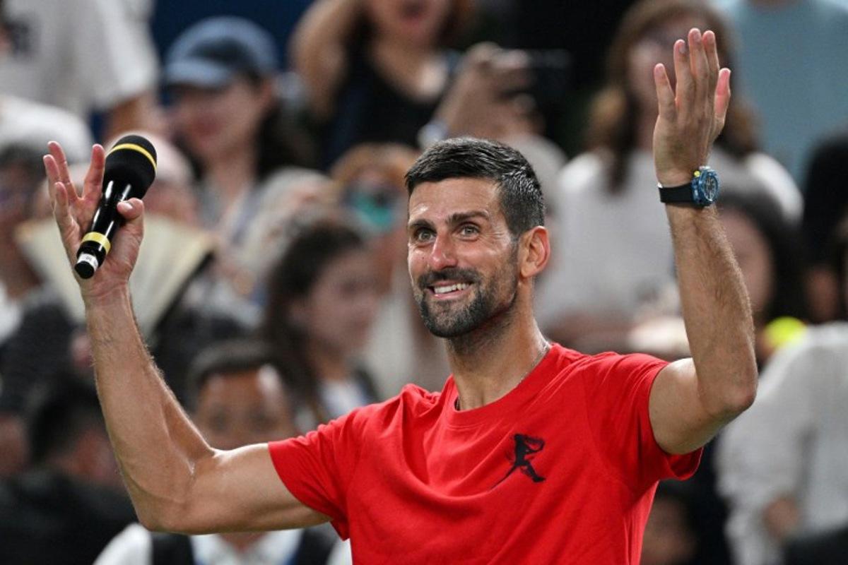 Serbia's Novak Djokovic celebrates winning his quarter-final men's singles match against Belgium's Zizou Bergs at the Shanghai Masters tennis tournament in Shanghai on October 9, 2025.   Hector RETAMAL / AFP