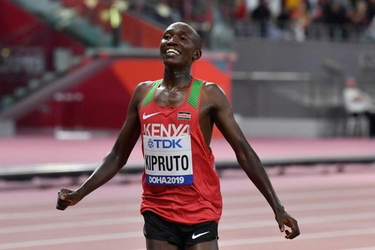 Kenya's Rhonex Kipruto celebrates finishing third in the Men's 10,000m final at the 2019 IAAF Athletics World Championships at the Khalifa International stadium in Doha on October 6, 2019.  ANDREJ ISAKOVIC / AFP