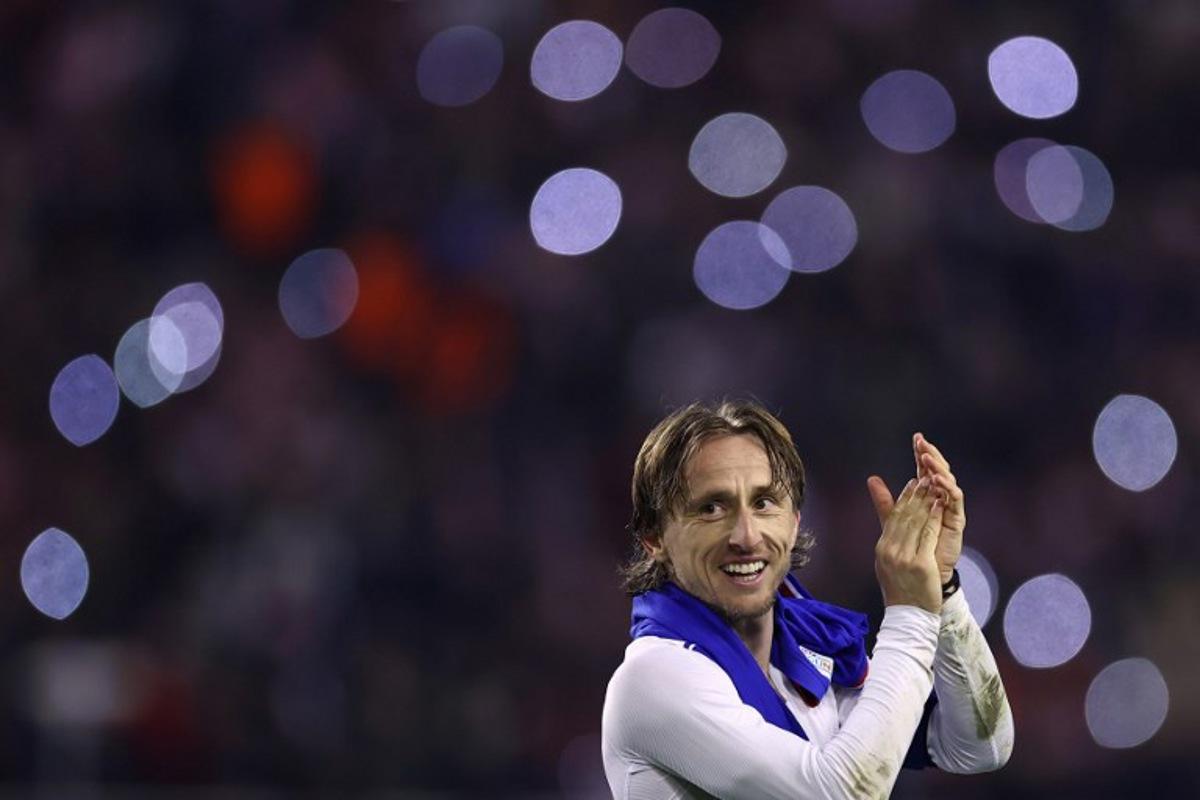 Croatia's midfielder #10 Luka Modric celebrates after winning  the UEFA Nations League quarter-final first-leg football match between Croatia and France at the Poljud Stadium in Split, on March 20, 2025.  FRANCK FIFE / AFP