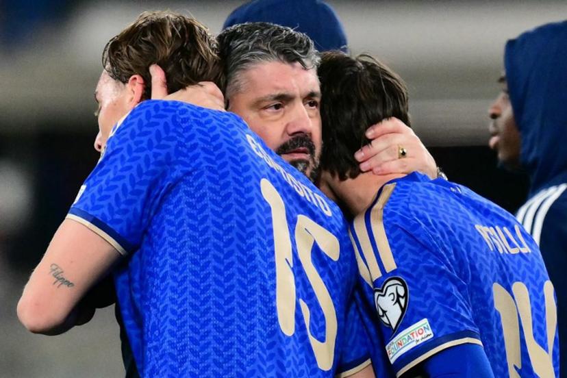 Italy's headcoach Gennaro Gattuso hugs Italy's forward #15 Francesco Pio Esposito and Italy's midfielder #14 Niccolo Pisilli after winning the play-off FIFA World Cup 2026 European qualification semi-final football match between Italy and North Ireland at the Gewiss stadium in Bergamo, on March 26, 2026.   Stefano RELLANDINI / AFP