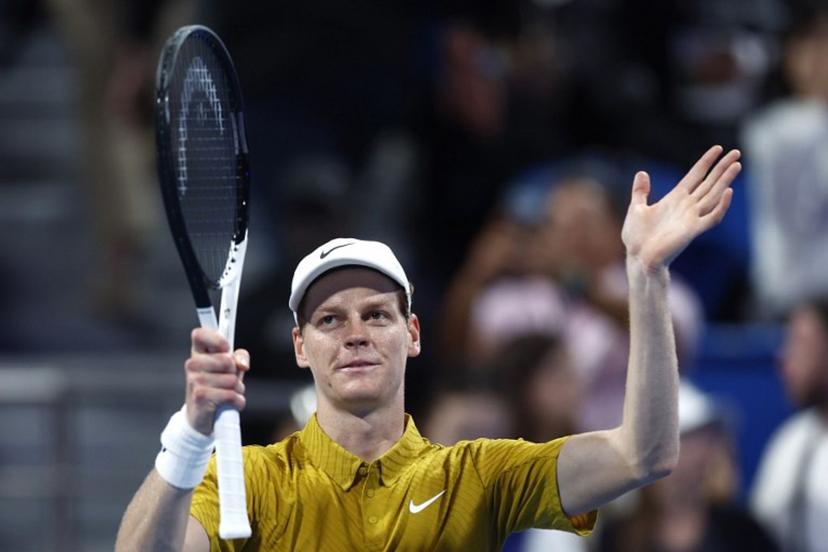 Italy's Jannik Sinner greets the fans after defeating Australia's Alexei Popyrin in their men's singles match at the Qatar Open tennis tournament in Doha on February 18, 2026.  Karim JAAFAR / AFP
