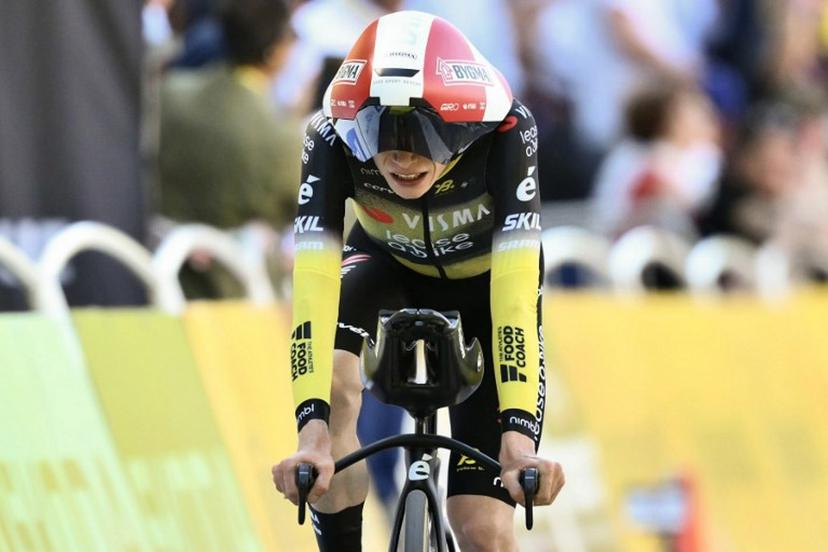 Team Visma - Lease a bike team's Danish rider Jonas Vingegaard cycles to the finish line of the 5th stage of the 112th edition of the Tour de France cycling race, 33 km individual time trial starting and finishing in Caen, northwestern France, on July 9, 2025.  Marco BERTORELLO / AFP