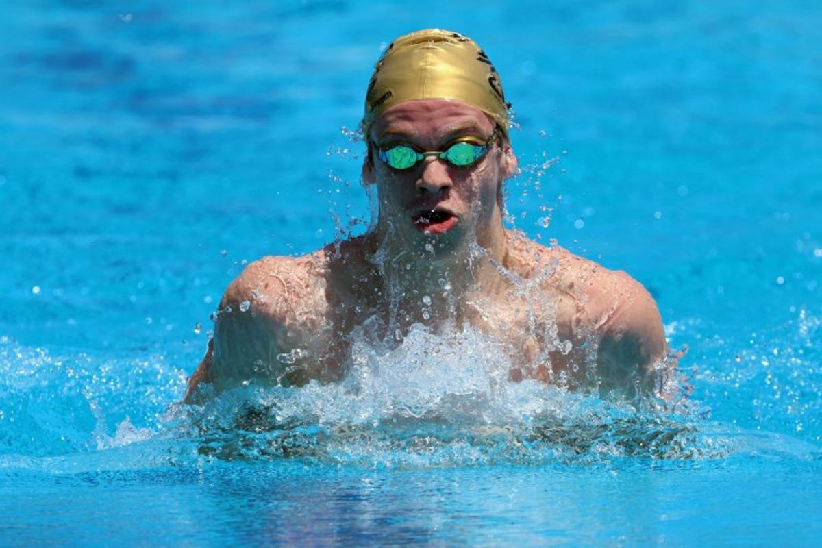 French four-time olympic gold medallist Leon Marchand trains at the "Piscine du Chaudron" swimming pool in Saint-Denis de la Reunion on December 21, 2024, before competing in the "meeting de l'Ocean indien" swimming event. The competition runs until December 22, 2024. Richard BOUHET / AFP