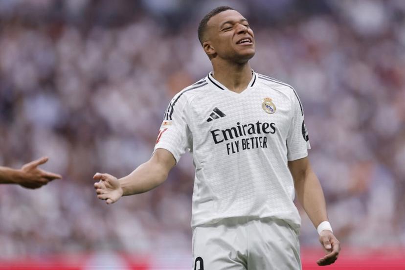 Real Madrid's French forward #09 Kylian Mbappe reacts during the Spanish league football match between Real Madrid CF and Real Sociedad at Santiago Bernabeu Stadium in Madrid on May 24, 2025.  OSCAR DEL POZO / AFP
