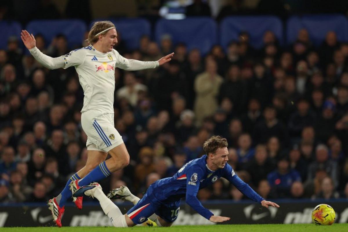 Leeds United's Belgian defender #23 Sebastiaan Bornauw (L) is booked for this foul on Chelsea's English midfielder #10 Cole Palmer (R) during the English Premier League football match between Chelsea and Leeds United at Stamford Bridge in London on February 10, 2026.  Adrian Dennis / AFP