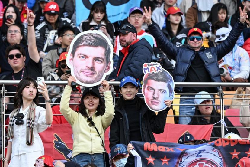 Supporters cheers with cut-outs of Red Bull Racing's Dutch driver Max Verstappen prior to the Formula One Chinese Grand Prix at the Shanghai International Circuit in Shanghai on March 15, 2026.  Greg Baker / AFP