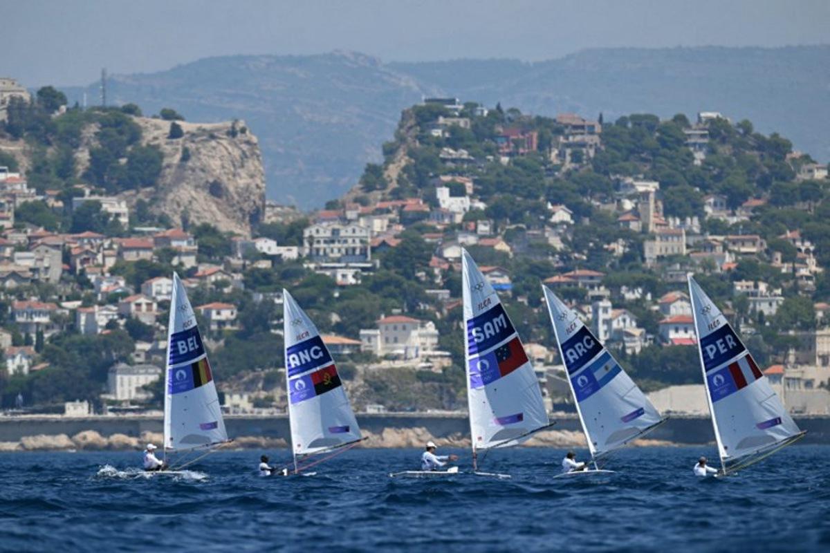 (LtoR) Belgium's William De Smet, Angola's Filipe Andre, Samoa's Eroni Leilua, Argentina's Francisco Guaragna Rigonat and Peru's Stefano Peschiera compete in race 7 of the men's ILCA 7 single-handed dinghy event during the Paris 2024 Olympic Games sailing competition at the Roucas-Blanc Marina in Marseille on August 4, 2024.   NICOLAS TUCAT / AFP