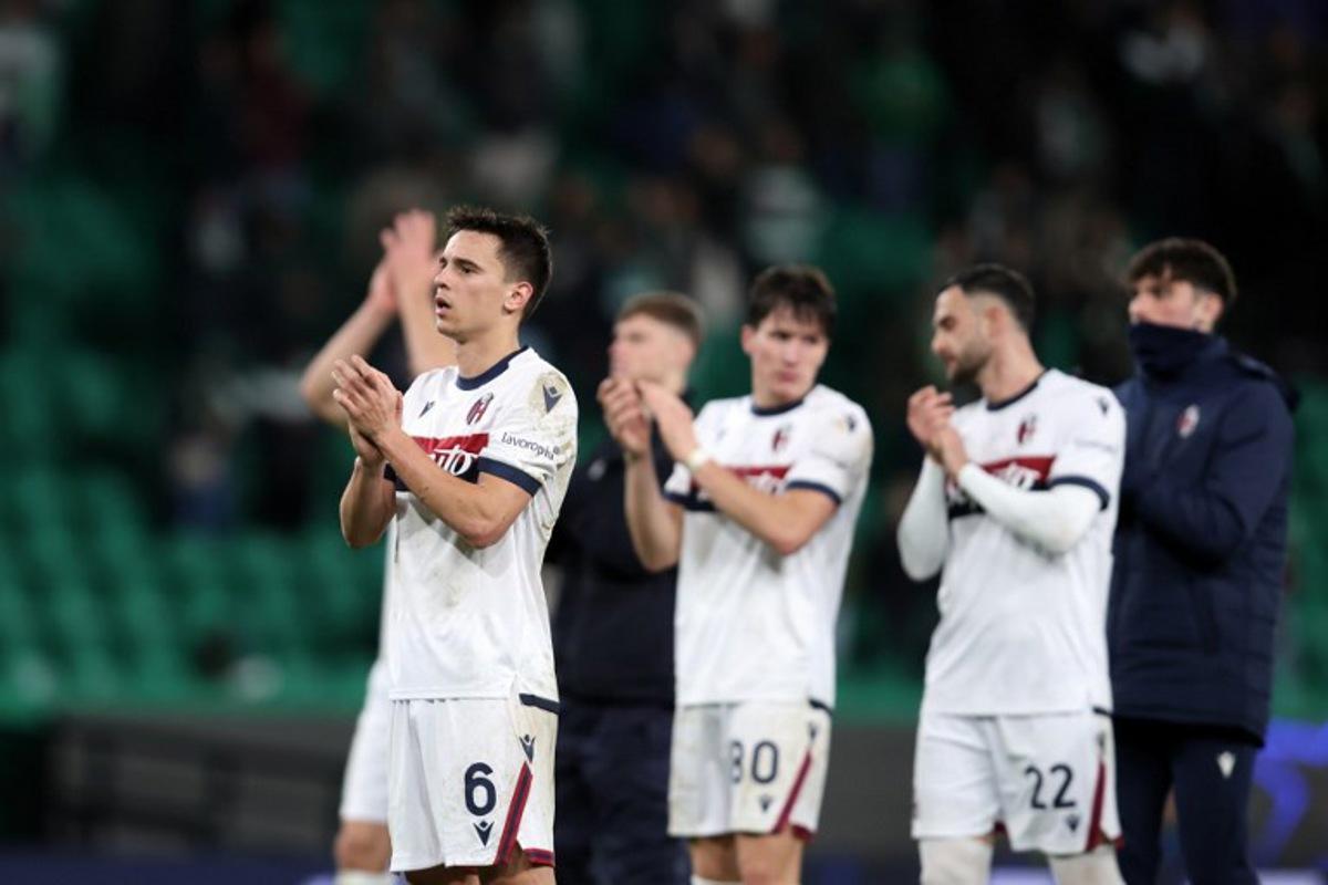 Bologna's Croatian midfielder #06 Nikola Moro and teammates react at the end of the league phase football match between Sporting CP and Bologna FC at Alvalade stadium in Lisbon on January 29, 2025.  Filipe AMORIM / AFP