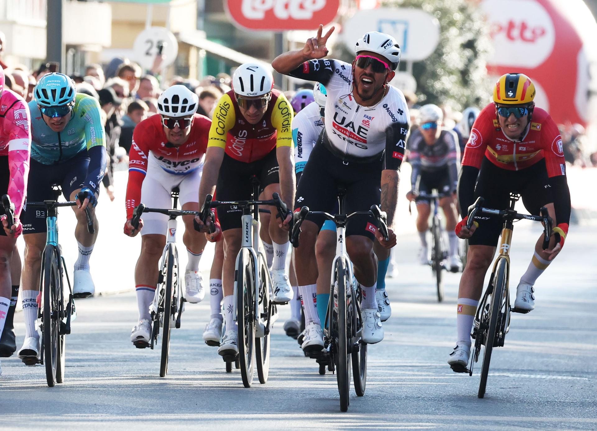 Colombian Sebastian Molano of UAE Team Emirates celebrates after winning the 'Classic Brugge-De Panne' men's elite one-day cycling race, 195,6 km from Brugge to De Panne, Wednesday 26 March 2025. BELGA PHOTO KURT DESPLENTER