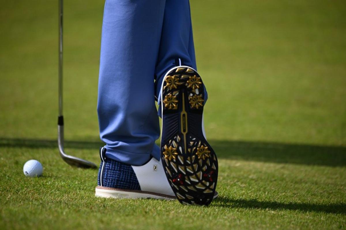 A detailed view of the shoes of US golfer Justin Thomas, seen during practice ahead of the 152nd British Open Golf Championship at Royal Troon on the south west coast of Scotland on July 15, 2024.  ANDY BUCHANAN / AFP