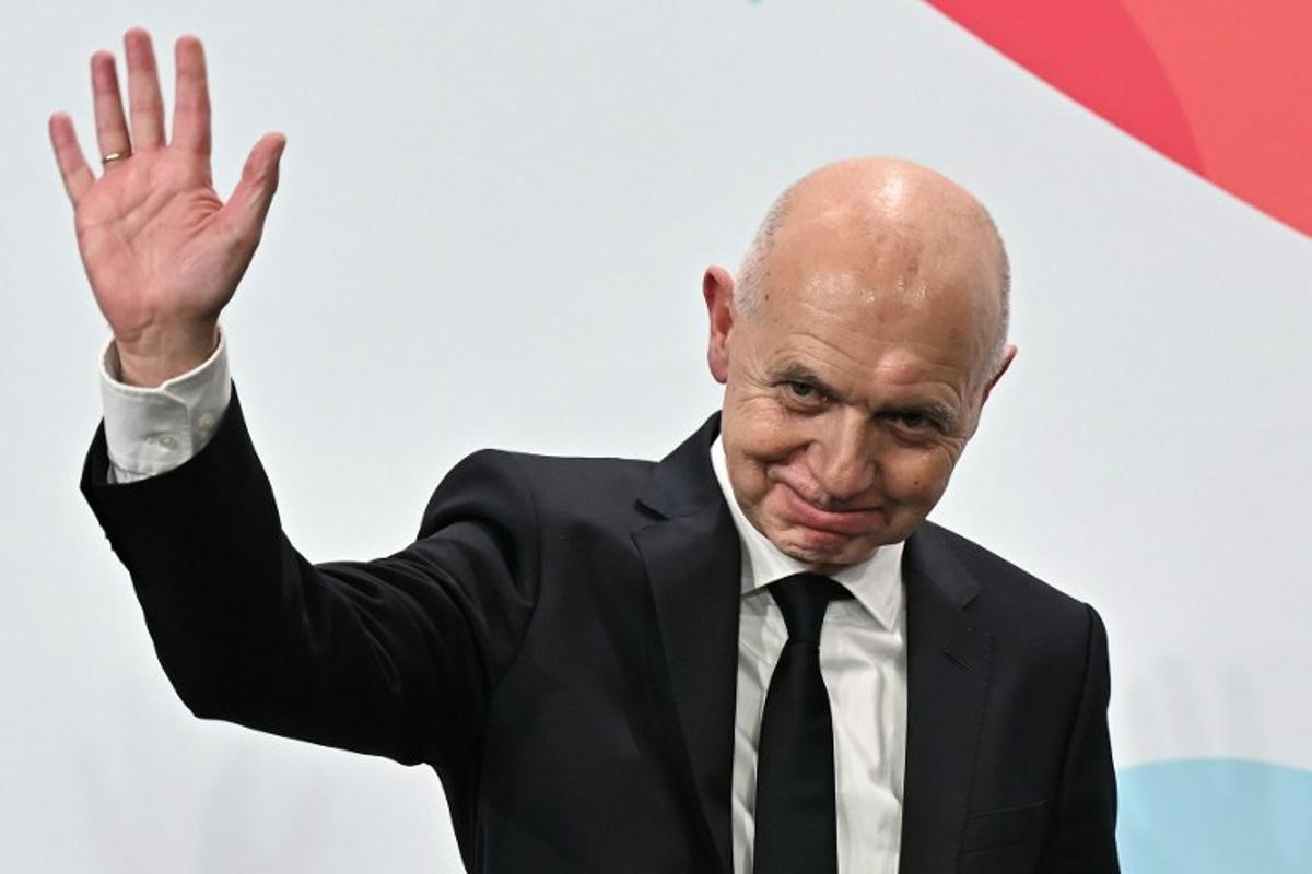 German Football Association (DFB) president Bernd Neuendorf waves to the audience after Germany was elected to host the UEFA Women's EURO 2029 fooball tournament during an announcement ceremony at the UEFA headquarters, the House of European Football, in Nyon on December 3, 2025. European football's governing body UEFA announced on December 3, 2025 that Germany will host the women's 2029 European Championships, where England will be the two-time defending champions.  Fabrice COFFRINI / AFP