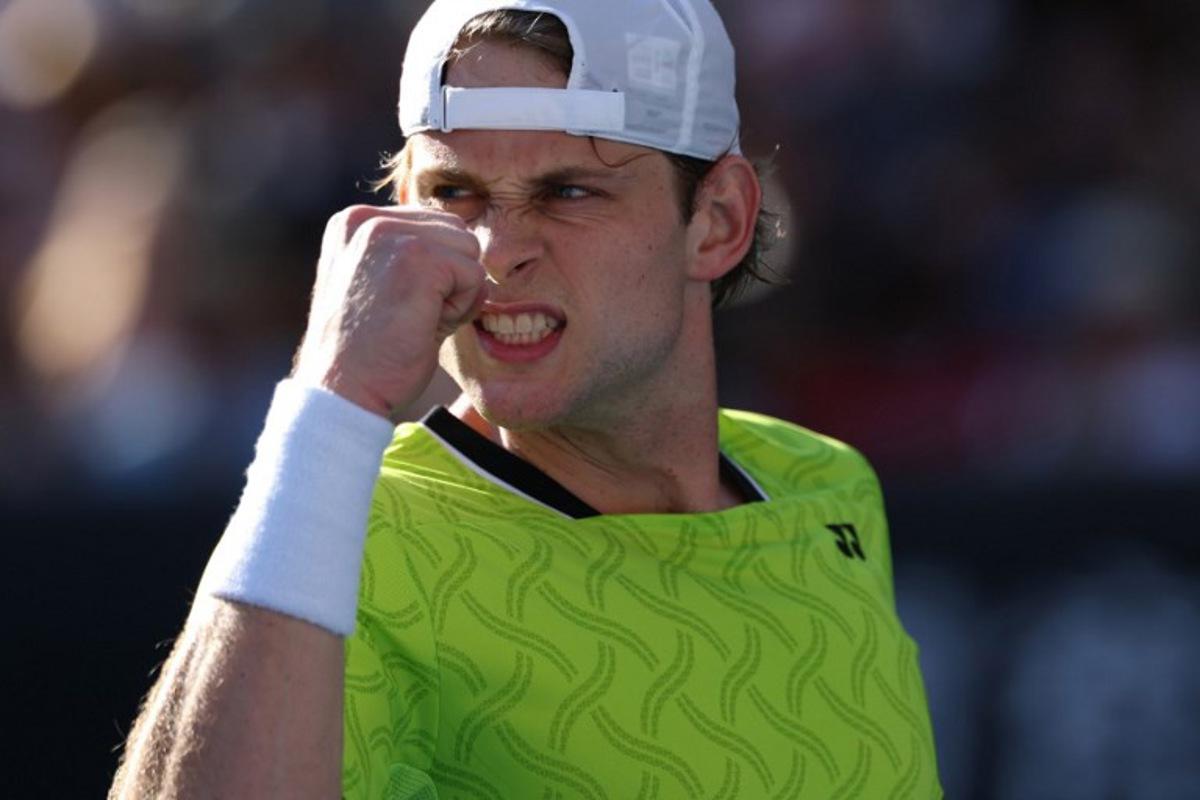Belgium's Zizou Bergs reacts after a point against Poland's Hubert Hurkacz during their men's singles match on day three of the Australian Open tennis tournament in Melbourne on January 20, 2026.  IZHAR KHAN / AFP