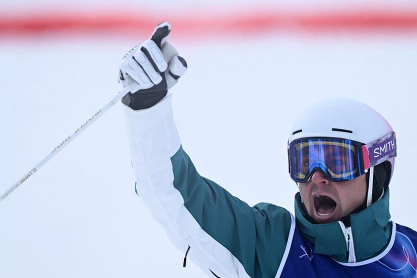 Australia's Cooper Woods reacts in the freestyle skiing men's moguls final 2 during the Milano Cortina 2026 Winter Olympic Games at Livigno Aerials & Moguls Park, in Livigno (Valtellina), on February 12, 2026.  Kirill KUDRYAVTSEV / AFP