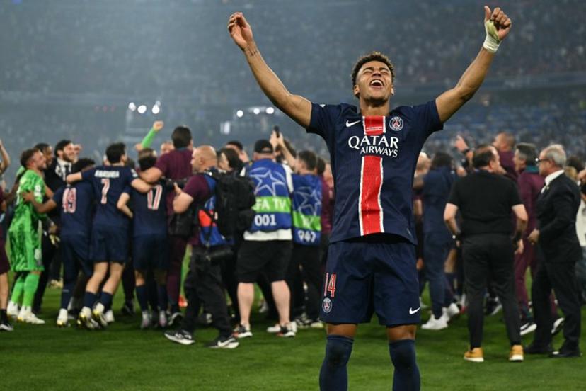 Paris Saint-Germain's French midfielder #14 Desire Doue (R) celebrates winning the UEFA Champions League final football match between Paris Saint-Germain (PSG) and Inter Milan in Munich, southern Germany, on May 31, 2025.  INA FASSBENDER / AFP
