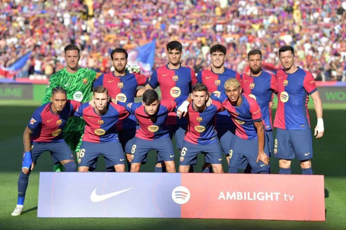 Barcelona players pose for  team photo before the Spanish league football match between FC Barcelona and Villarreal CF at Estadi Olimpic Lluis Companys in Barcelona on May 18, 2025.  MANAURE QUINTERO / AFP