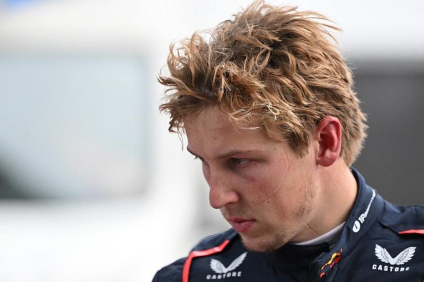 Red Bull Racing's New Zealand driver Liam Lawson walks back to his team garage after getting out of his car at the end of the Formula One Chinese Grand Prix in Shanghai on March 23, 2025.  GREG BAKER / AFP