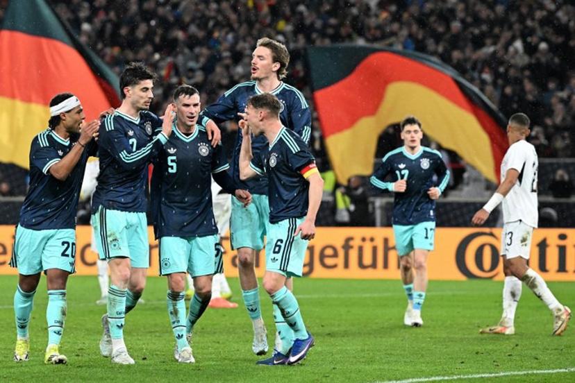 (From L) Germany's midfielder #20 Serge Gnabry, Germany's forward #07 Kai Havertz,  Germany's midfielder #05 Pascal Gross, Germany's forward #11 Nick Woltemade and Germany's defender #06 Joshua Kimmich celebrate their team's first goal scored by Havertz during the international friendly football match between Germany and Ghana in Stuttgart, southwestern Germany on March 30, 2026.  THOMAS KIENZLE / AFP