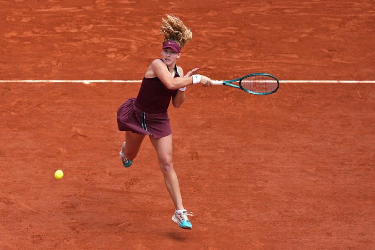 Russia's Mirra Andreeva plays a forehand return to Australia's Daria Kasatkina during their women's singles match on day 9 of the French Open tennis tournament on Court Suzanne-Lenglen at the Roland-Garros Complex in Paris on June 2, 2025.  Dimitar DILKOFF / AFP