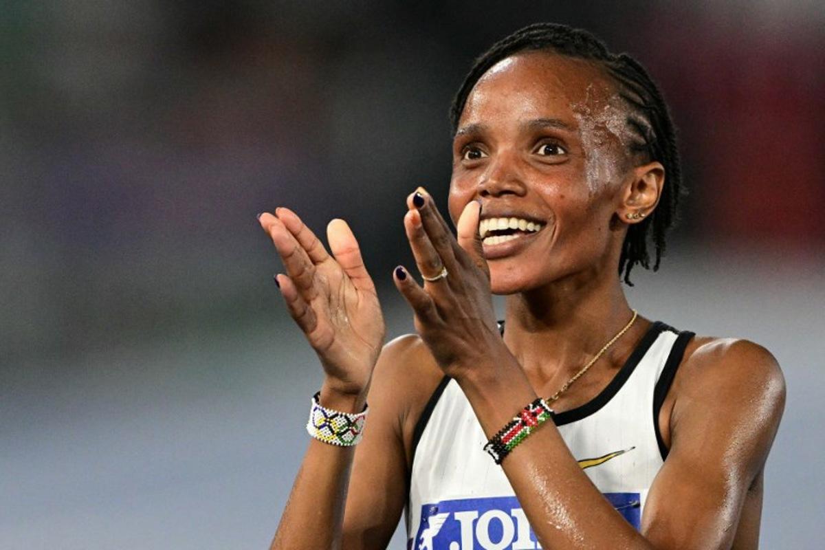 Kenya's Beatrice Chebet celebrates after winning the women's 5000m event of the Diamond League athletics meeting at the Olympic stadium in Rome on June 6, 2025.  Tiziana FABI / AFP
