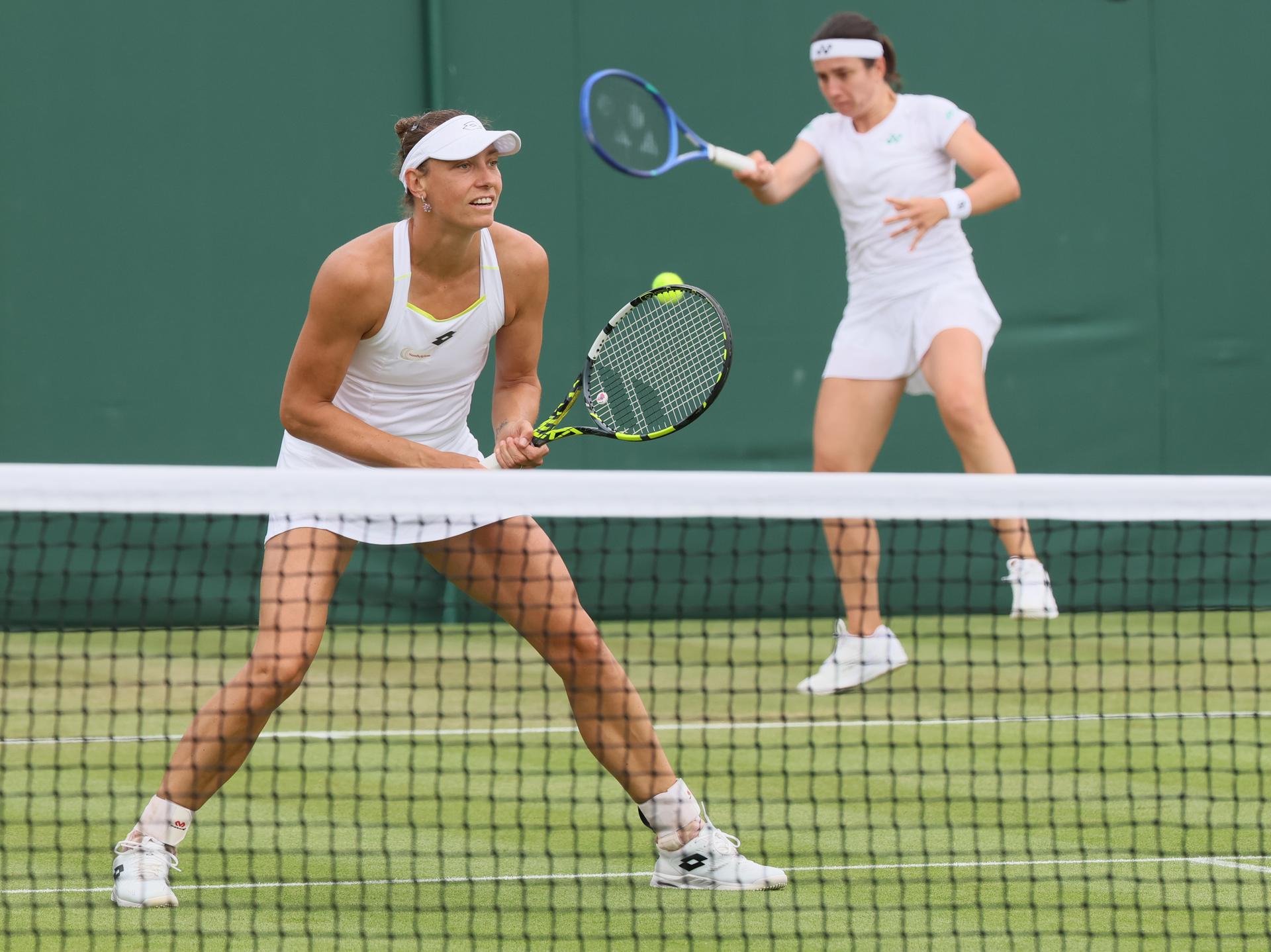 Belgian Yanina Wickmayer (R) and Latvian Anastasija Sevastova pictured during a doubles tennis match with Belgian-Latvian pair Wickmayer - Sevastova against Ukrainian-Romanian pair Kostyuk - Ruse, in the first round of the women's doubles at the 2025 Wimbledon grand slam tournament, Wednesday 02 July 2025 at the All England Tennis Club, in South-West London, Britain. BELGA PHOTO BENOIT DOPPAGNE