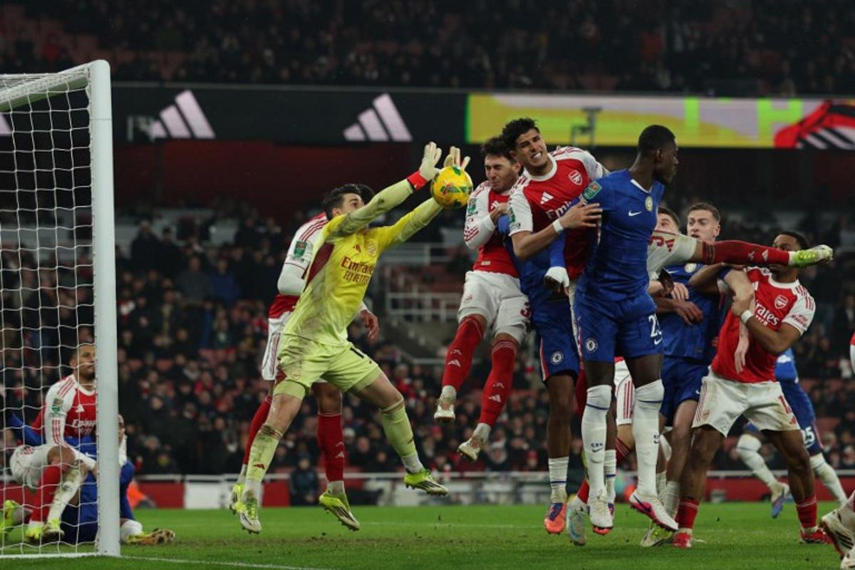 Arsenal's Spanish goalkeeper #13 Kepa Arrizabalaga makes a save during the English League Cup semi final second leg, football match between Arsenal and Chelsea at the Emirates Stadium, in London on February 3, 2026.  Adrian Dennis / AFP